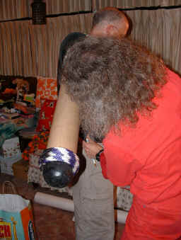 Steve Swope fitting tube to Bruce Hinterleitner's arm
